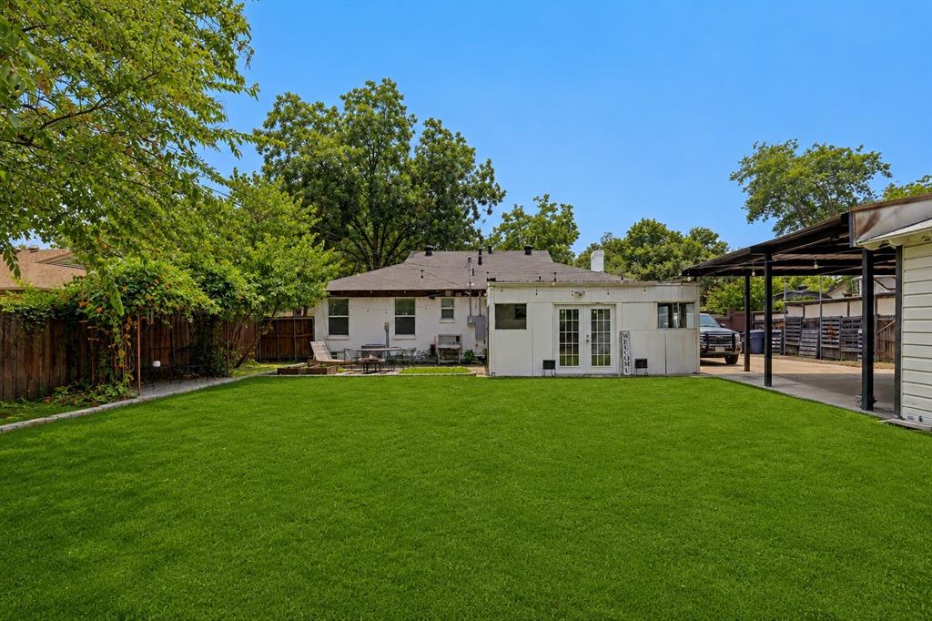Spacious backyard with tons of green space. Grass has been digitally enhanced to be greener.