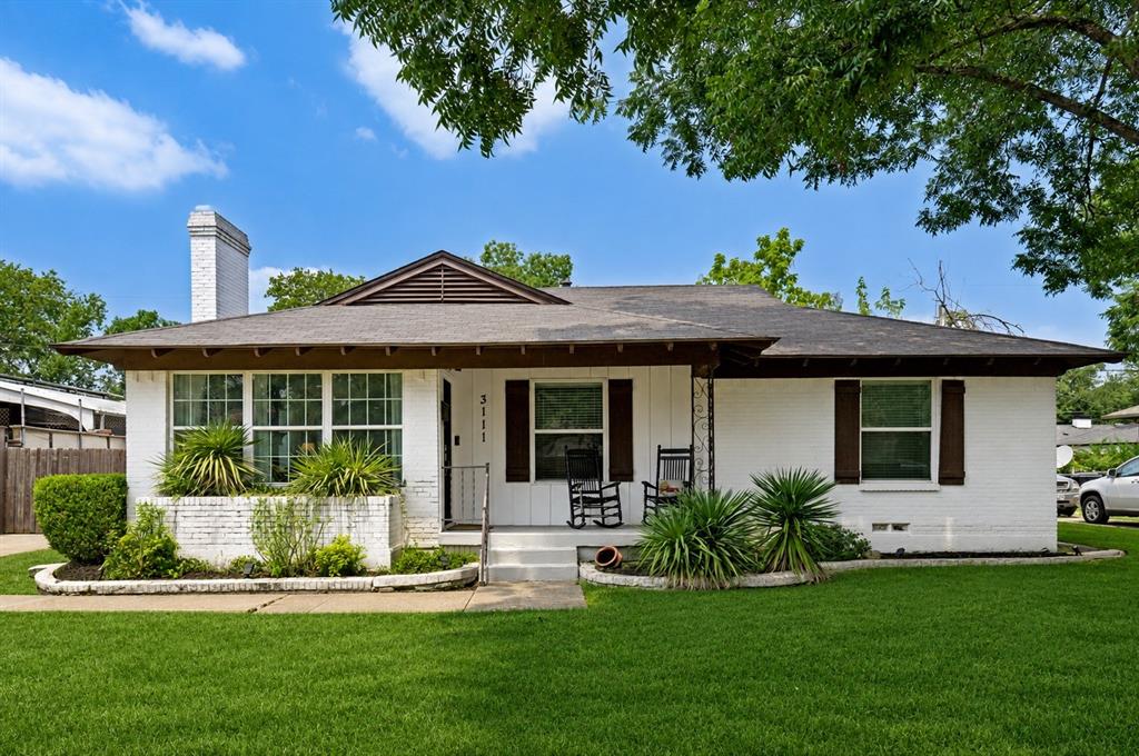 Precious ranch-style home with charming patio. Grass has been digitally enhanced to be greener.