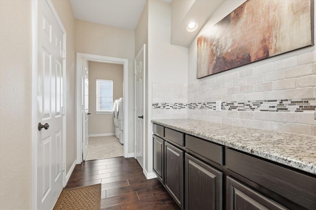 Mud room area leading to laundry