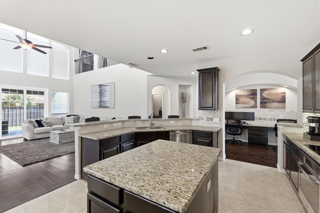 Granite, stainless steel appliances and electric cooktop
