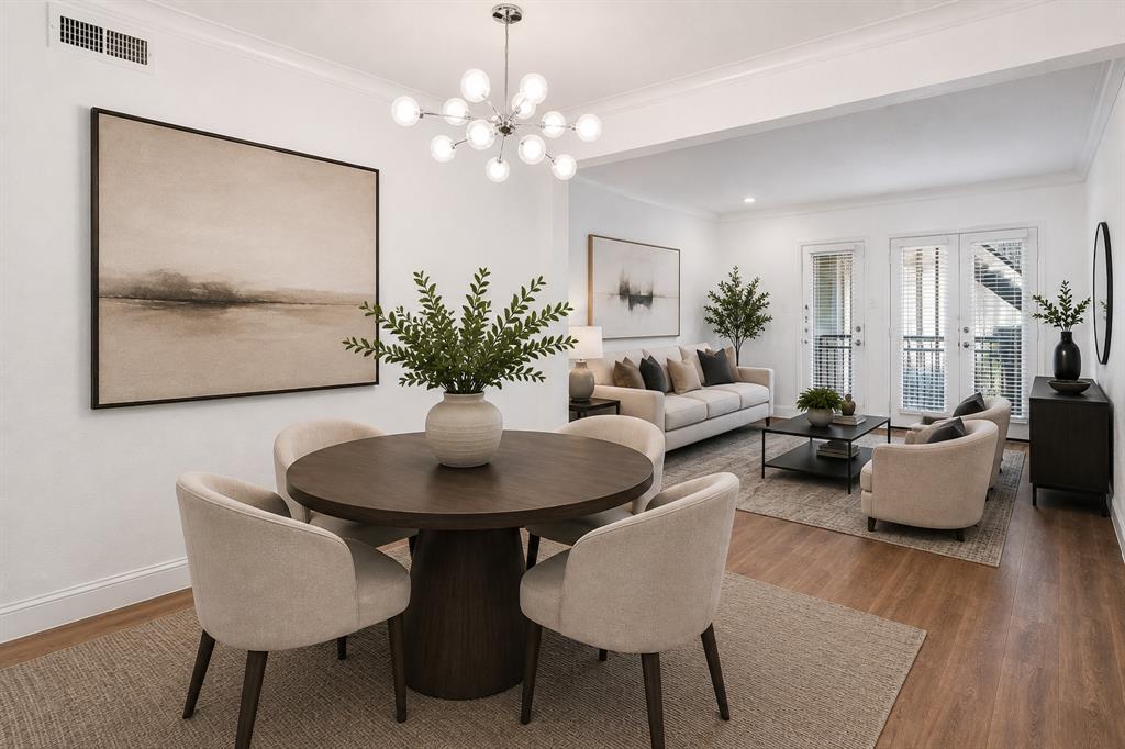 Virtually staged view highlighting the open connection between the dining and living areas, creating a comfortable layout for everyday living and entertaining.