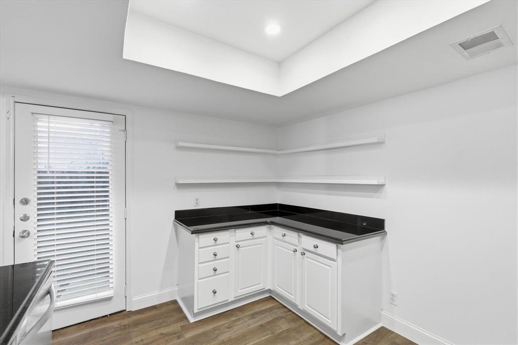 Additional counter and cabinet space provides a useful prep, serving or beverage area in your large kitchen space.