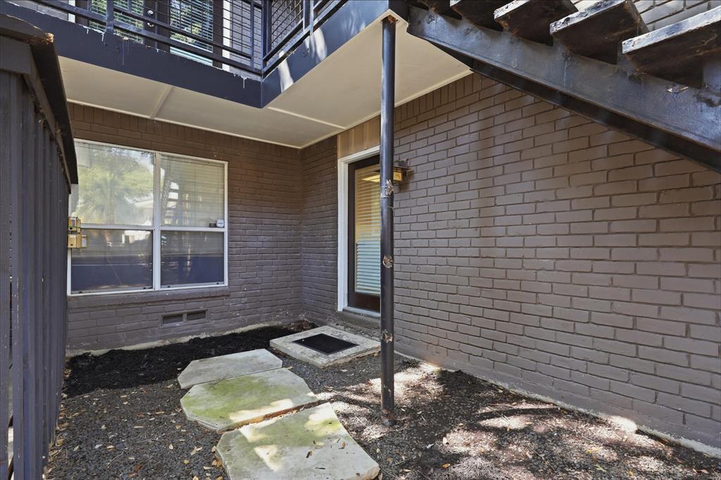 Rear entrance/exit to condo #109 goes straight into the kitchen.