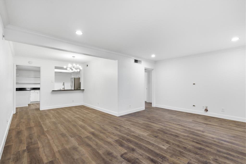 View from the living room toward the dining area, illustrating the open flow between the two main living spaces.