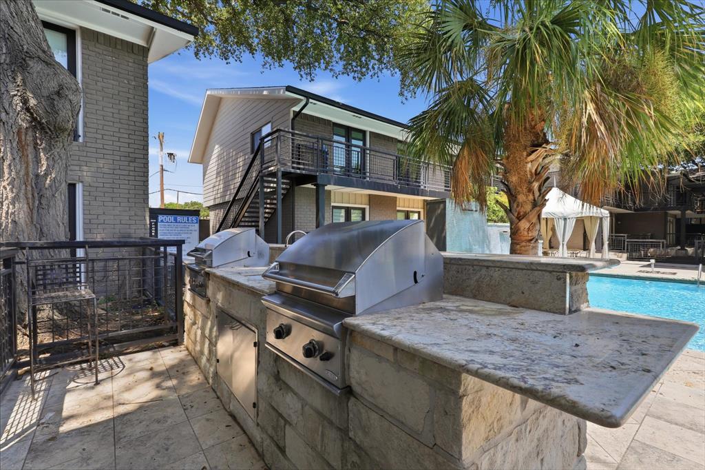Built-in community grilling station offering additional outdoor space for residents to enjoy.