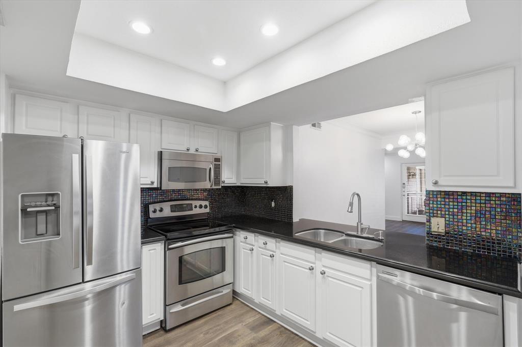 View from the kitchen toward the dining area, showing the easy connection between the kitchen and main living spaces.