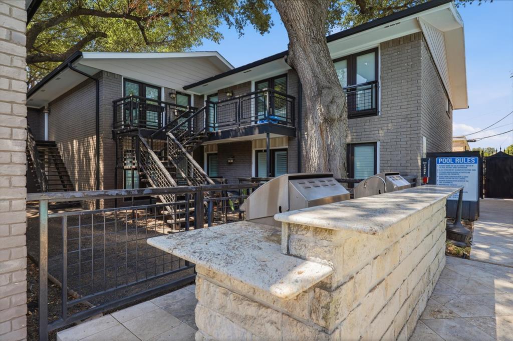 Residential outdoor grilling and gathering area conveniently located near the pool and moments from your condo.