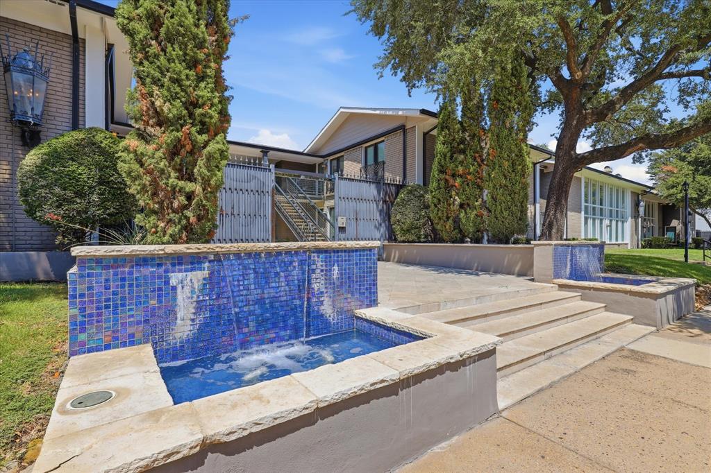 Community entry area with established landscaping and a welcoming courtyard setting.