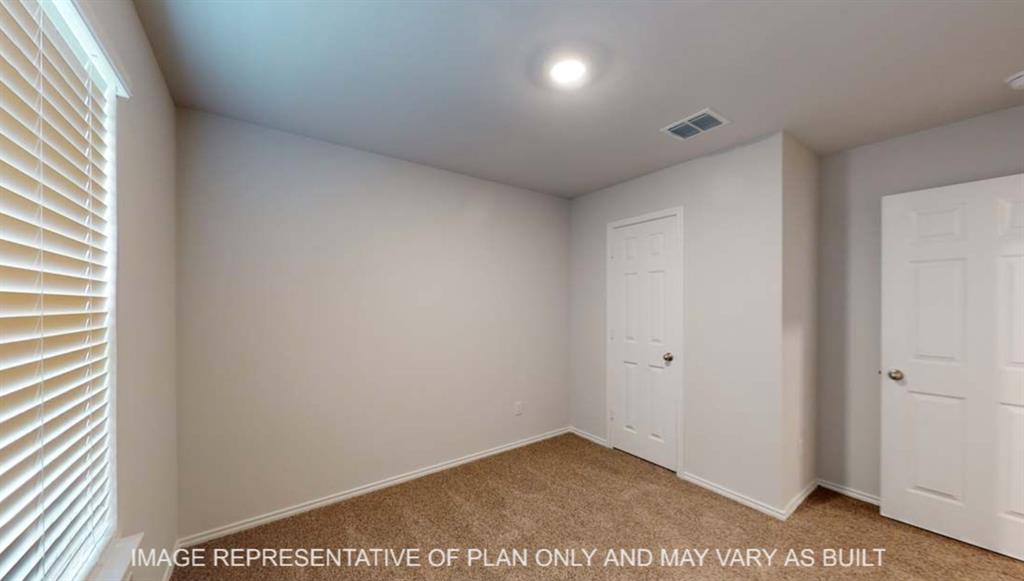 Carpeted flooring, white interior doors, window with blinds, recessed ceiling lighting, and neutral wall tones
