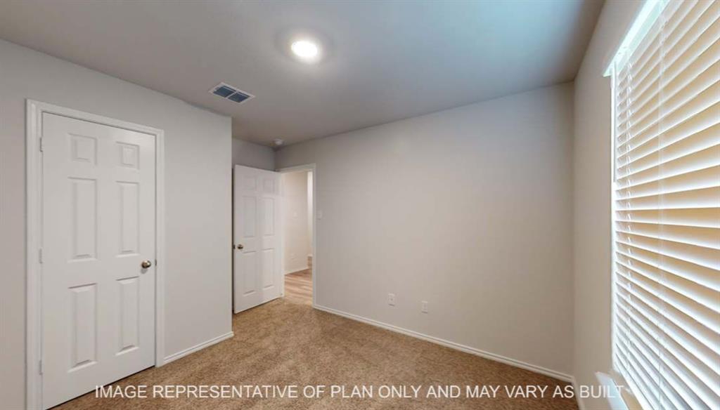 Wall-to-wall carpeting, window with blinds, recessed lighting, and white interior doors