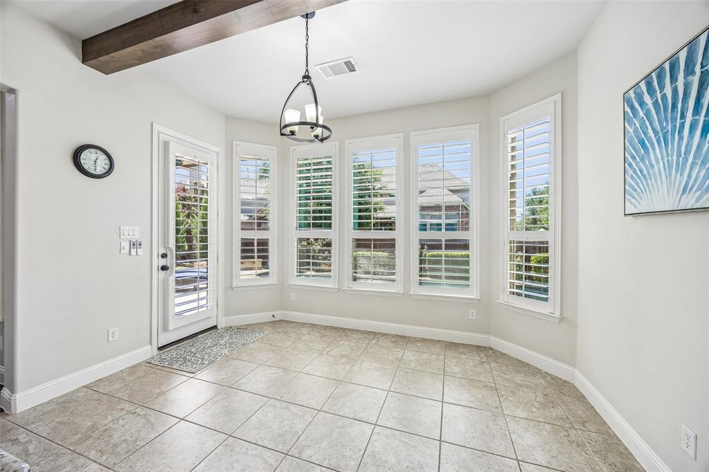 Bay windows flank the second dining area