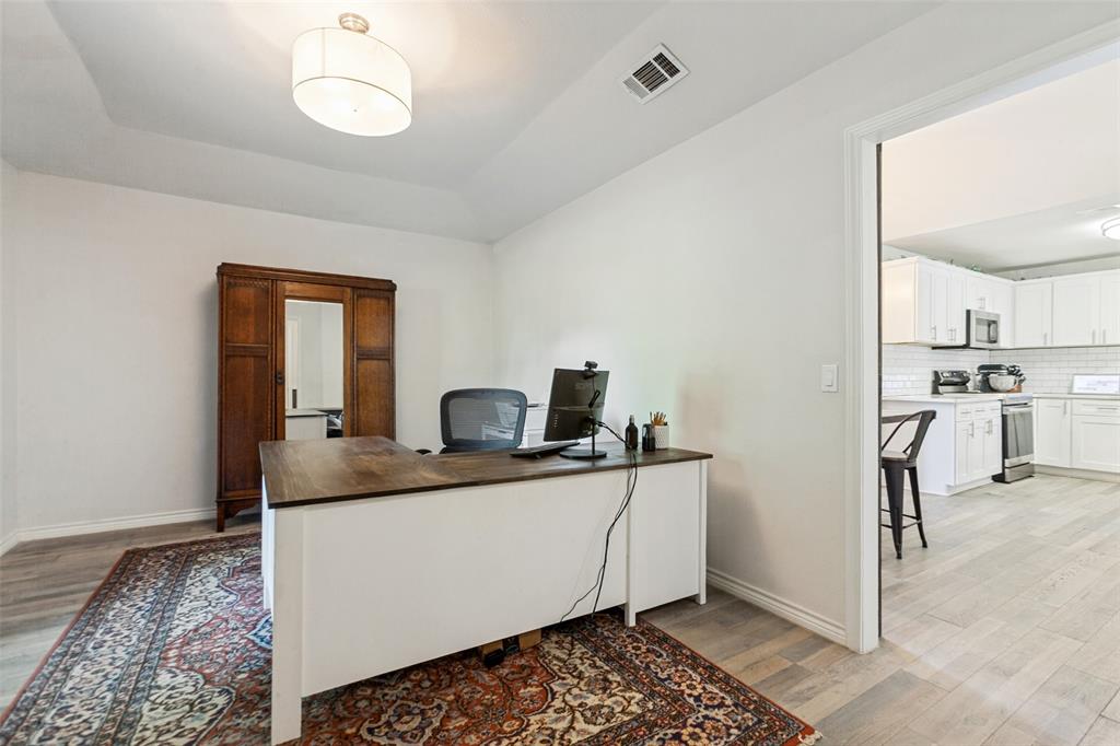 Tray ceiling featuring a flush-mount drum light fixture