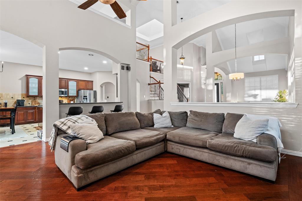 Warm hardwood floors and soaring ceilings create an impressive gathering space.