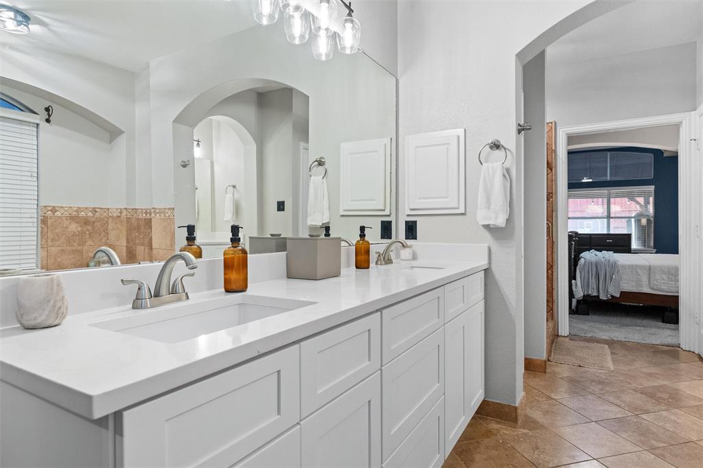 Primary bath updated July 2026 with new cabinets, dual sinks, new fixtures and quartz counter tops