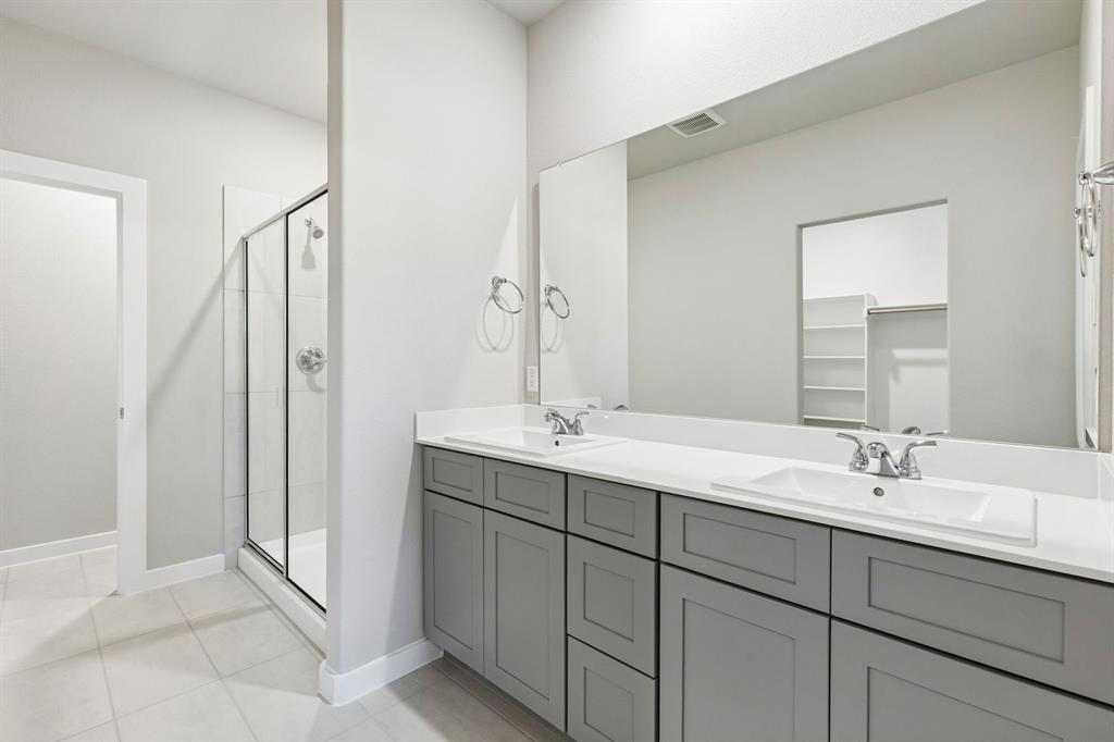 Primary Bathroom in the Haylee home plan by Trophy Signature Homes - REPRESENTATIVE PHOTO