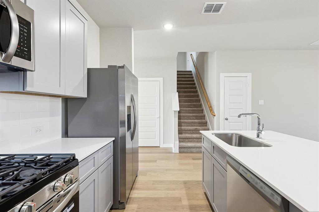 Kitchen in the Haylee home plan by Trophy Signature Homes - REPRESENTATIVE PHOTO Kitchen in the Haylee home plan by Trophy Signature Homes - REPRESENTATIVE PHOTO