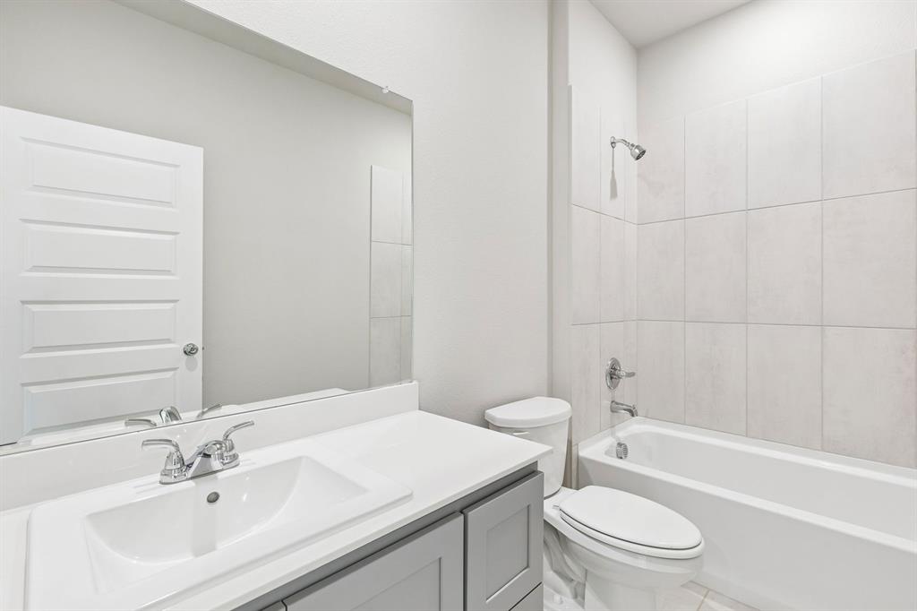 Bathroom in the Haylee home plan by Trophy Signature Homes - REPRESENTATIVE PHOTO