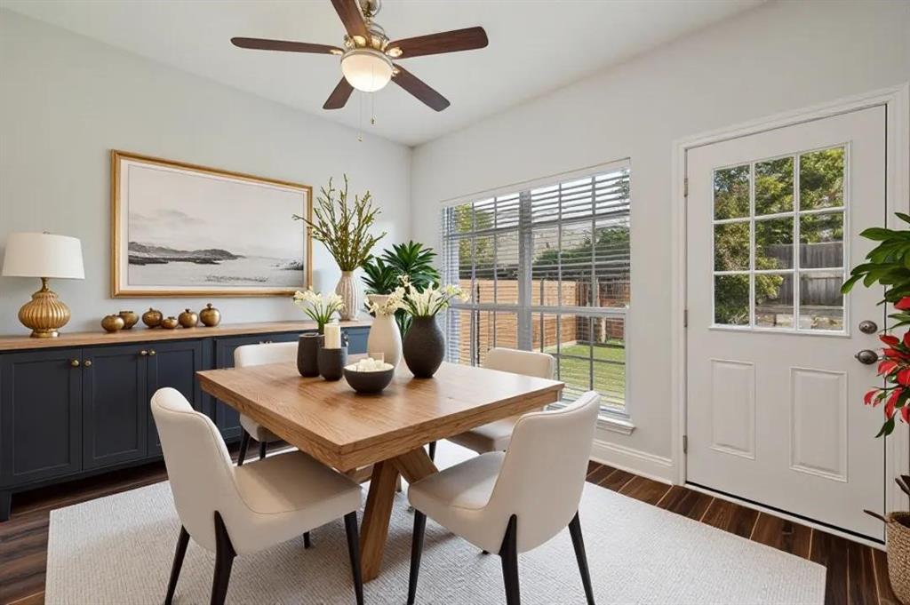 Wood-finish flooring with a light area rug
