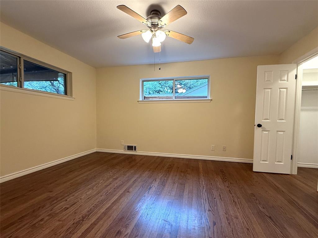The primary bedroom is located at the back of the house, with windows welcoming the morning light and a view of the roses in the back yard. The primary bedroom is located at the back of the house, with windows welcoming the morning light and a view of the roses in the back yard.