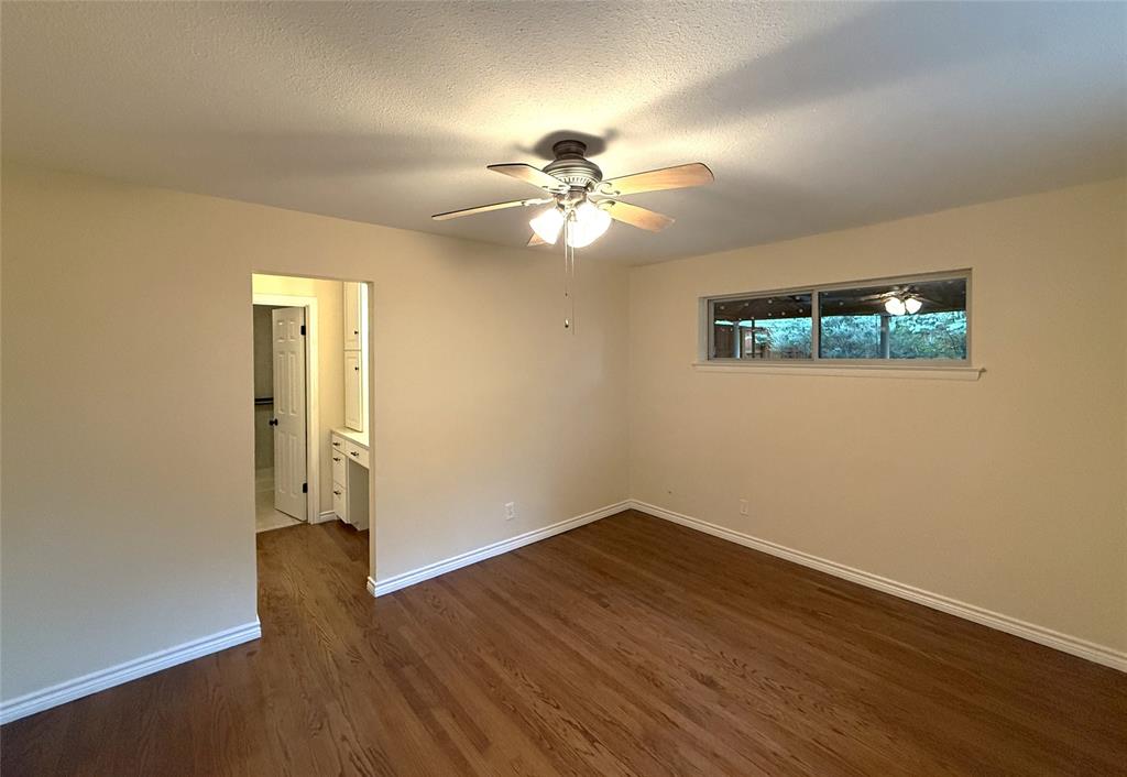 Primary bedroom and entry to dressing area and walk in closet Primary bedroom and entry to dressing area and walk in closet