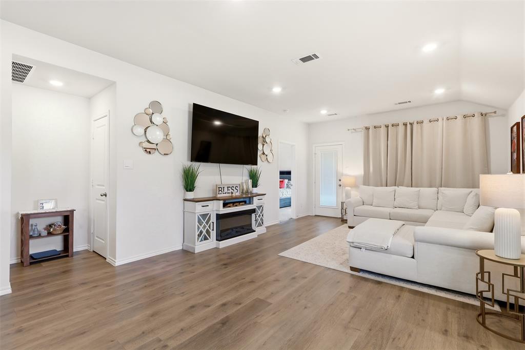 Recessed lighting, wood-finish flooring, white walls