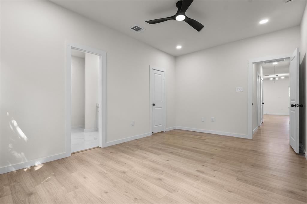 Recessed lighting, wood-finish flooring, and a ceiling fan