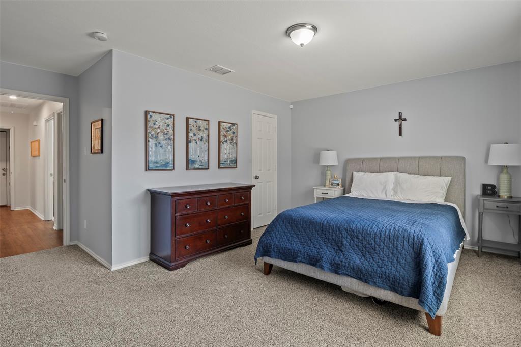 Wall-to-wall carpeting with light gray wall paint and a flush mount ceiling light