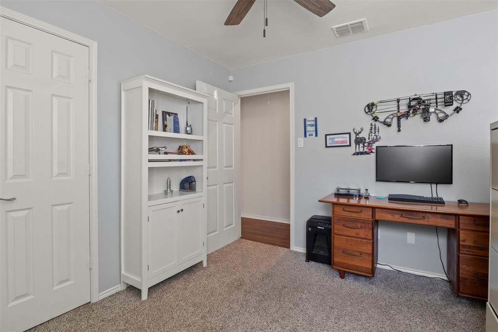 Neutral wall color, ceiling fan, and carpeted flooring