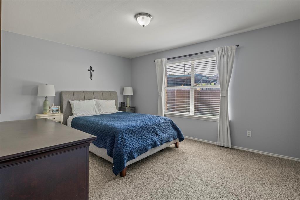 Carpeted flooring, window with blinds, ceiling-mounted light fixture, light gray wall paint
