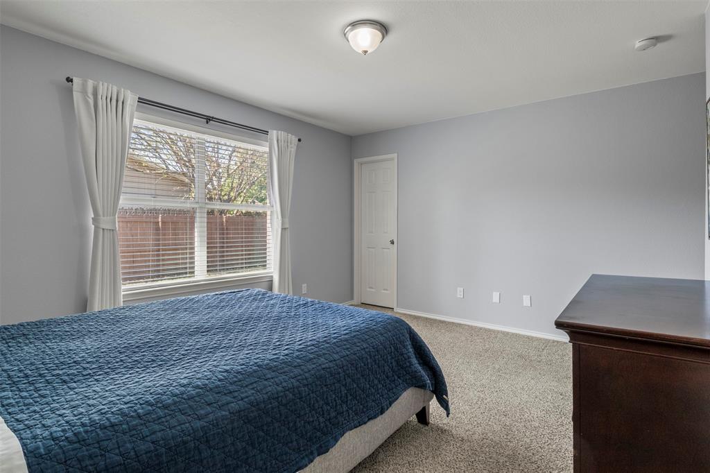 Wall-to-wall carpeting and a ceiling-mounted light fixture