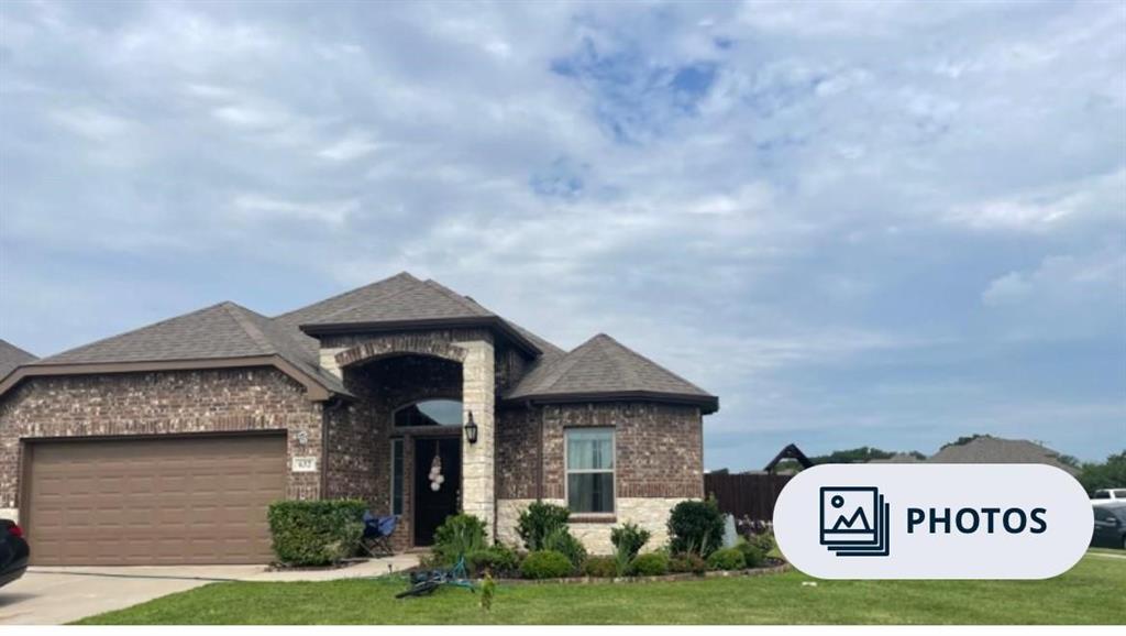 Brick and stone exterior with architectural shingles