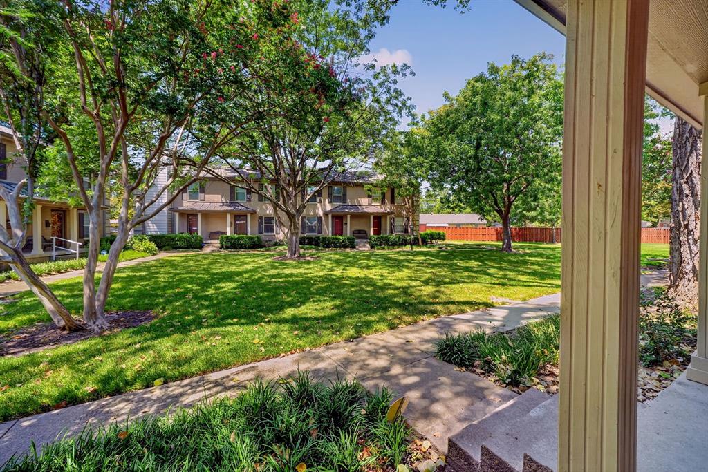 The view of the lush lawn of the greenbelt from the front porch.