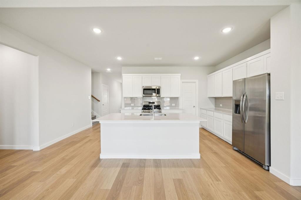Kitchen in the Masters home plan by Trophy Signature Homes – REPRESENTATIVE PHOTO Kitchen in the Masters home plan by Trophy Signature Homes – REPRESENTATIVE PHOTO