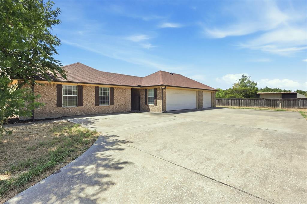 3-Car garage and extended driveway gives ample room for parking and storage.