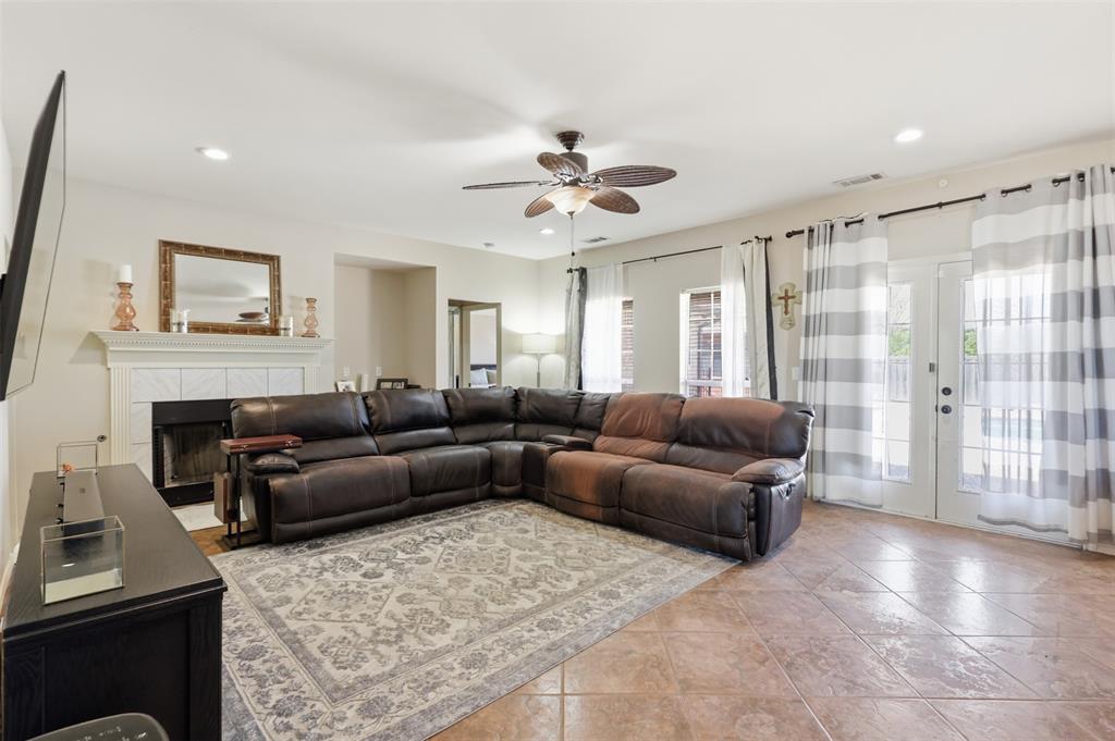 The wall of windows add lots of natural light and lead to the private oasis in the backyard.