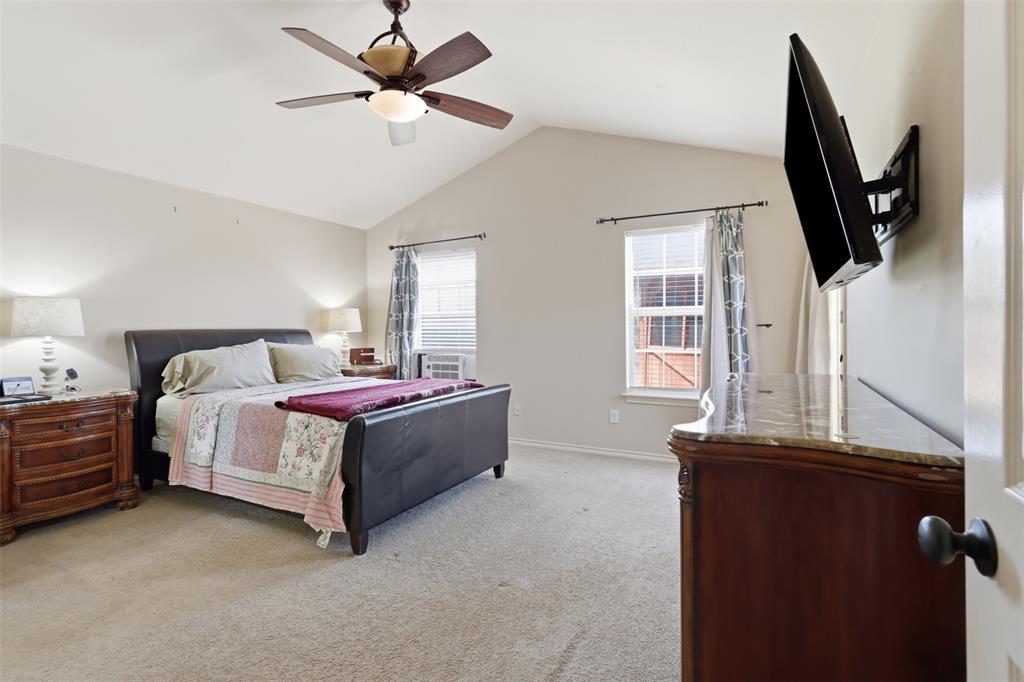 Large primary bedroom is on a separate hallway with walk-in closet and en-suite bathroom.
