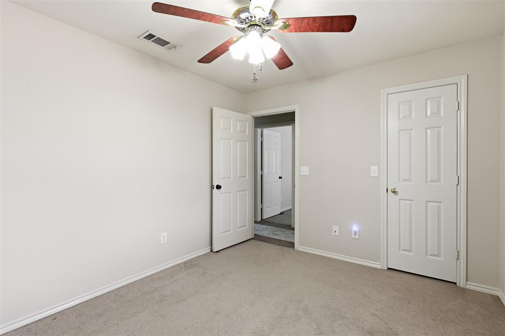 Alternate view of third bedroom looking towards hallway.