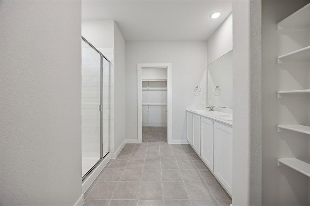 Primary Bathroom in the Oak II home plan by Trophy Signature Homes – REPRESENTATIVE PHOTO