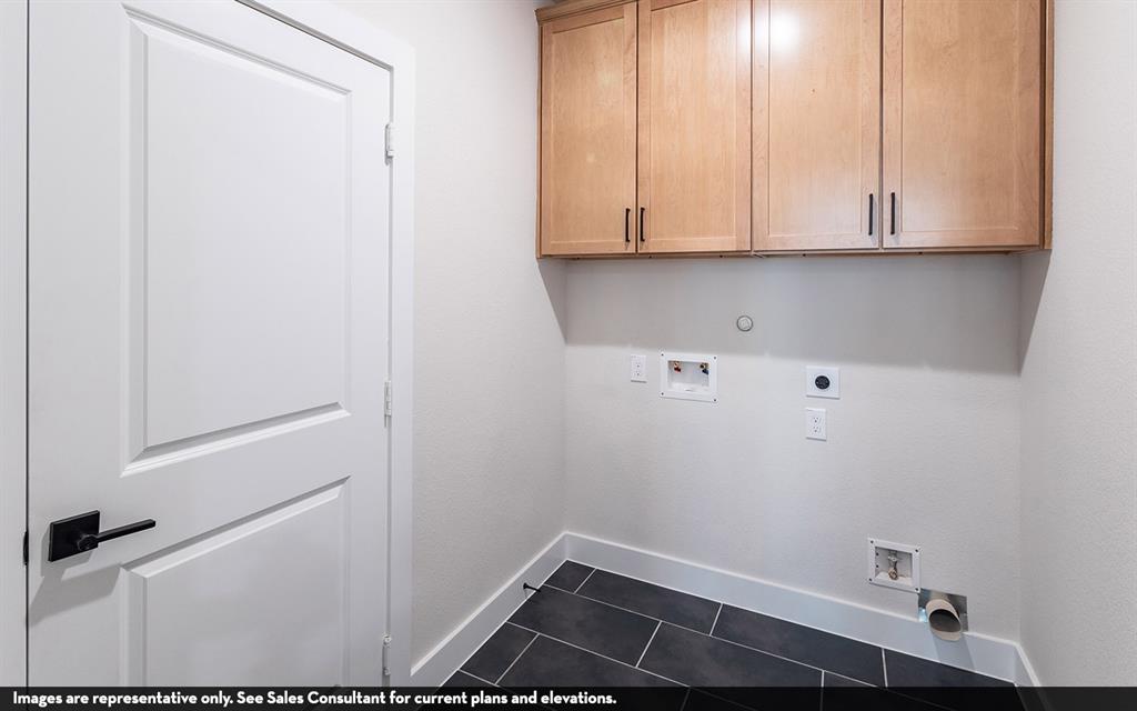 Light wood-finish cabinetry with matte black pulls