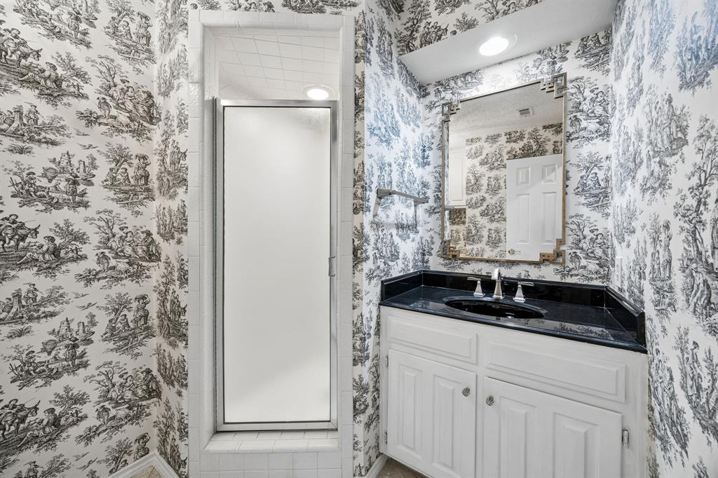 The third bath is split from the others and features a shower.