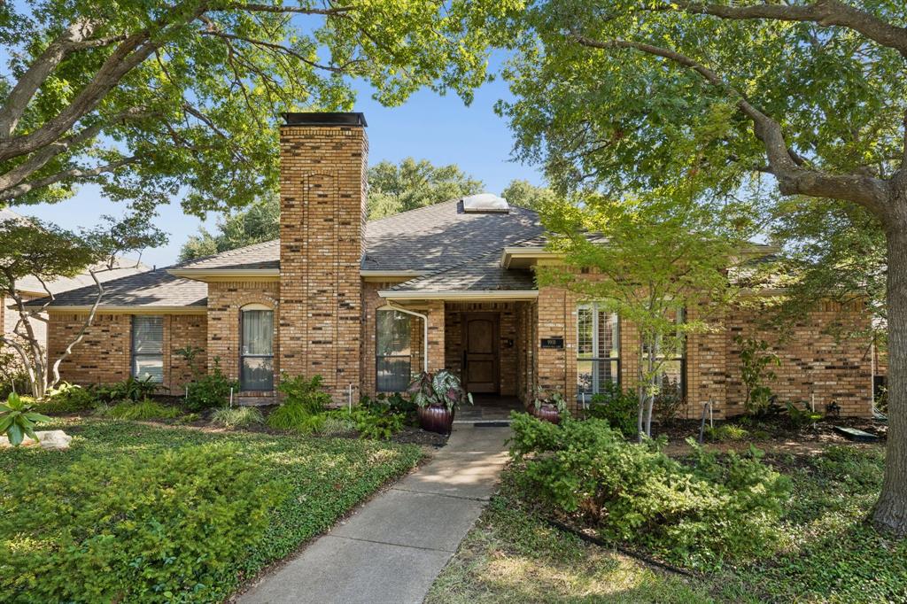 The front yard has freshly updated gardens to welcome you and your guests.