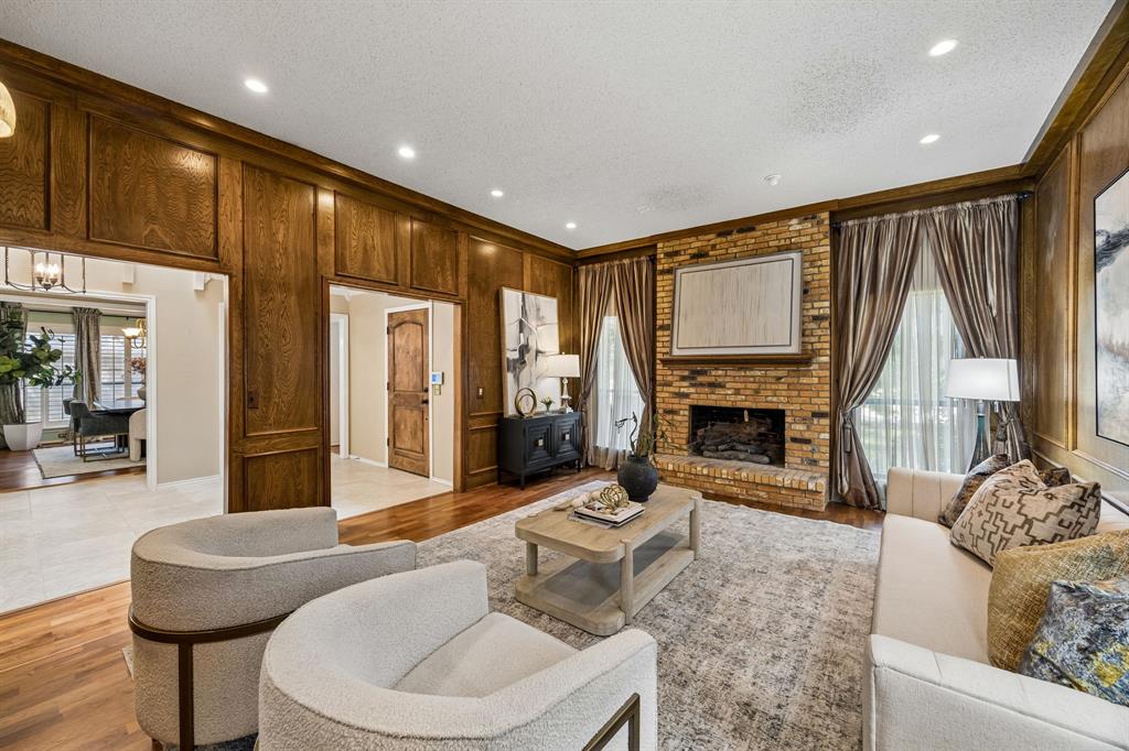 The living room is just off the entry and easy access to the dining and kitchen spaces.