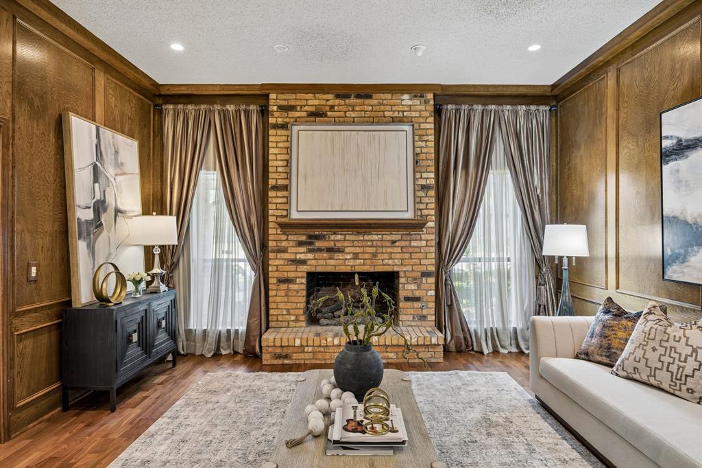 The living room fireplace is the focal point of this large living space.