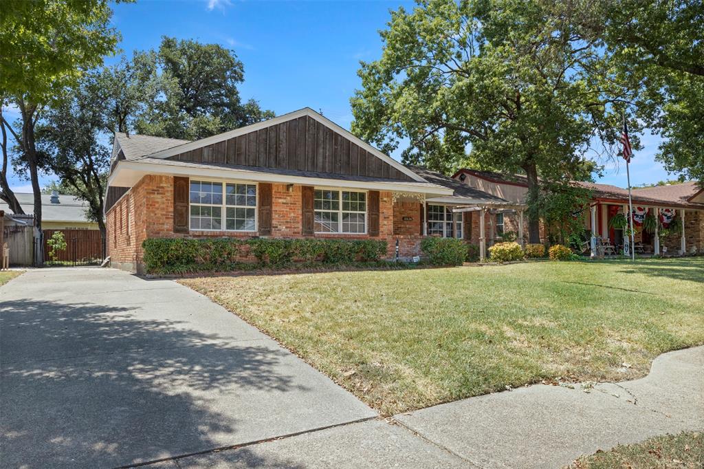 Brick exterior with a gabled roofline and board and batten siding Brick exterior with a gabled roofline and board and batten siding