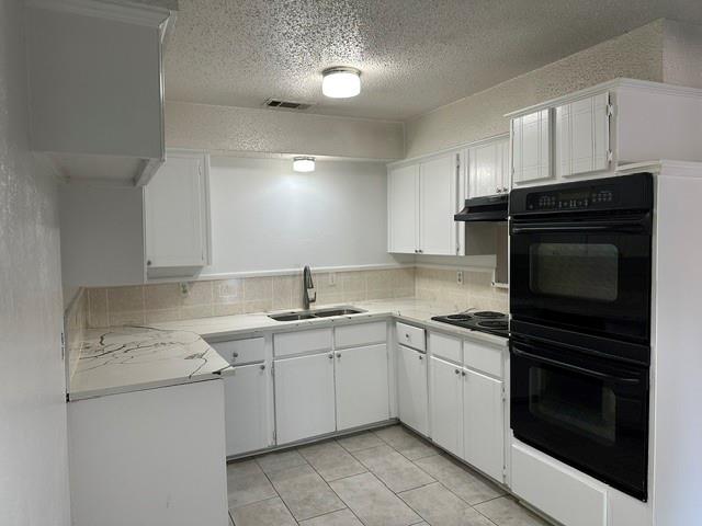 Kitchen featuring double ovens