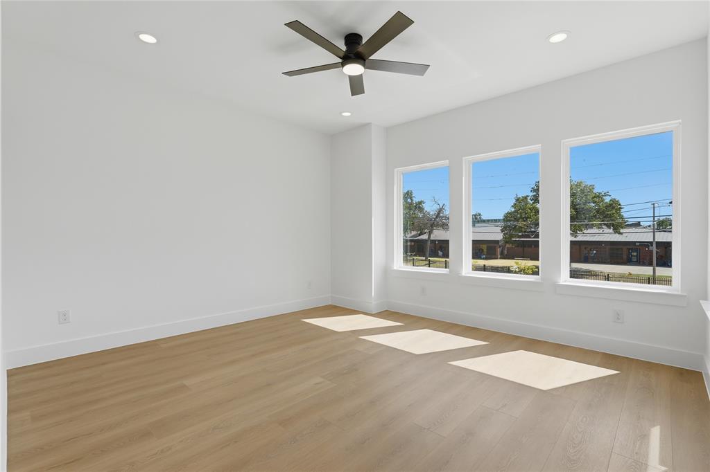 Wood-finish flooring, recessed lighting, and a ceiling fan with integrated lighting