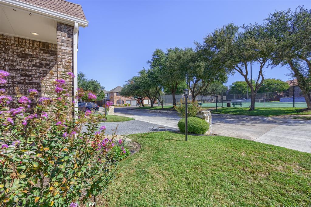 Front view of home looking across North Capistrano to tennis/pickleball courts.