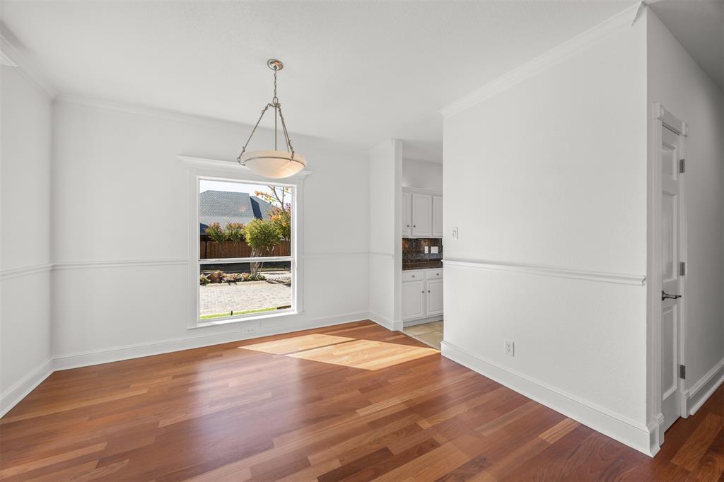 Photograph looking from front entrance into the Dining Room and Kitchen entrance.
