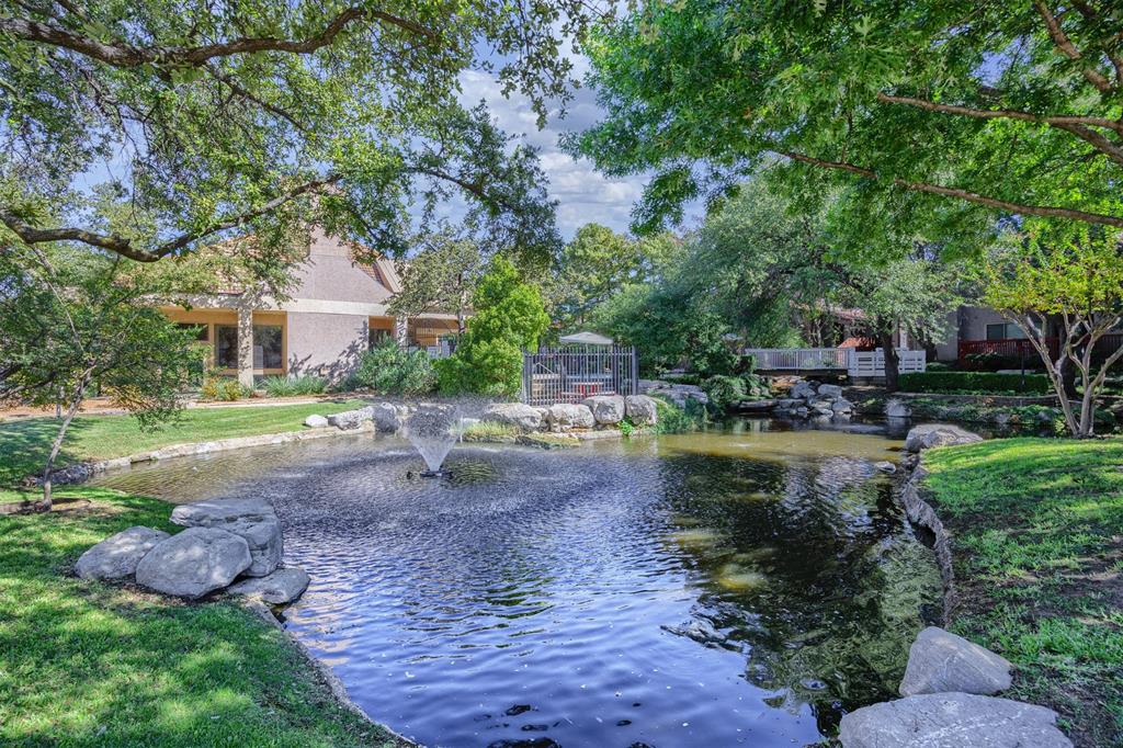 Pond and water feature adjacent to community pool.