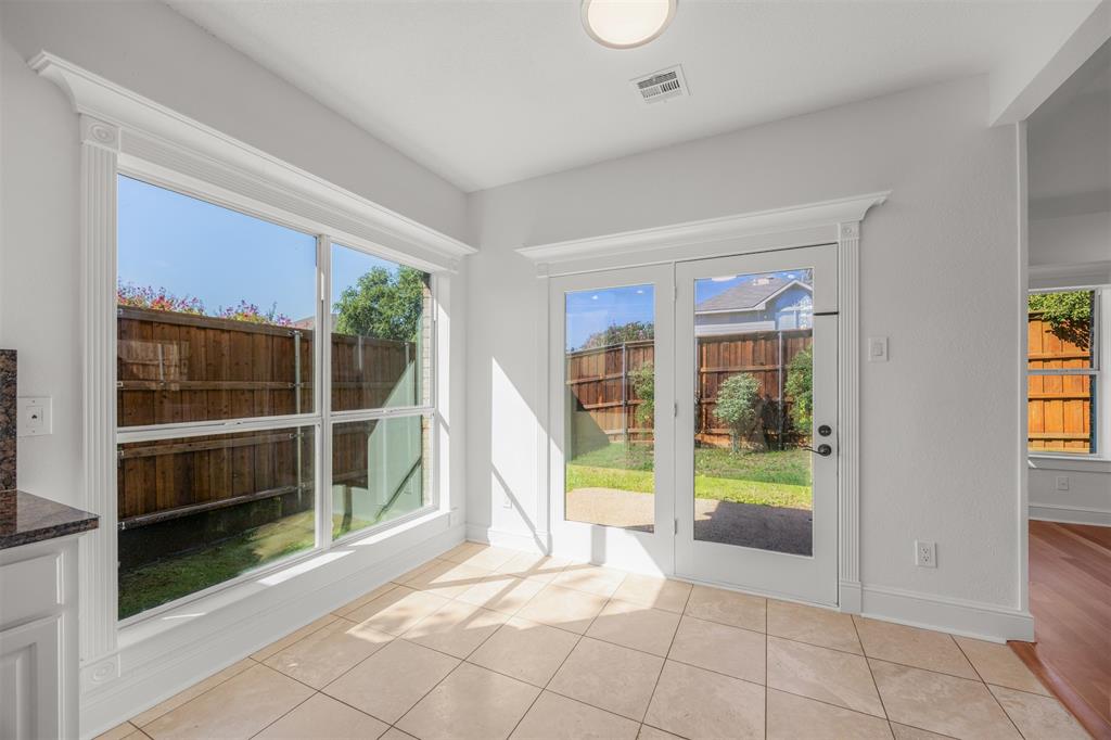 Travertine floors, custom trim surrounding windows and patio doors.  New double insulated, low E glass has been installed.